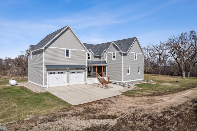 view of front of house with board and batten siding, a garage, a front lawn, concrete driveway, and a shingled roof