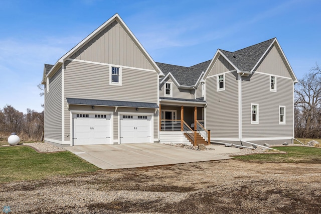 view of front facade featuring an attached garage, covered porch, board and batten siding, and concrete driveway