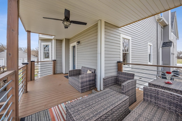wooden deck with a ceiling fan