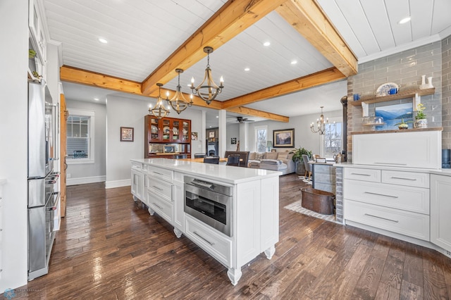kitchen with beam ceiling, light countertops, white cabinetry, baseboards, and dark wood-style floors