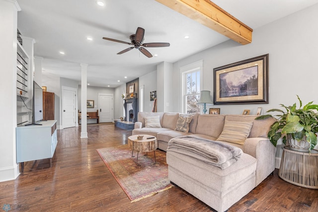 living room with recessed lighting, decorative columns, and wood finished floors