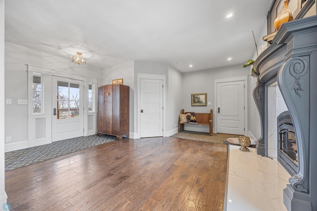 entrance foyer with baseboards, recessed lighting, and wood finished floors