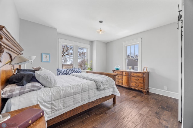 bedroom featuring baseboards and dark wood-type flooring