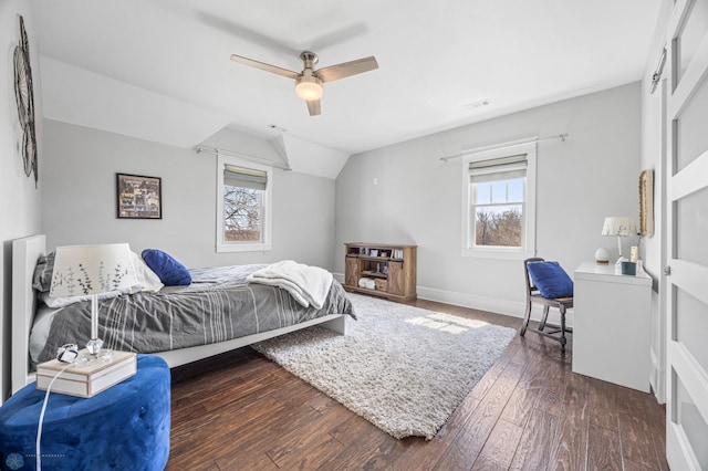 bedroom featuring multiple windows, dark wood-style floors, ceiling fan, and visible vents