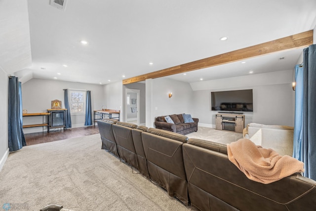 living room with recessed lighting, baseboards, and light carpet