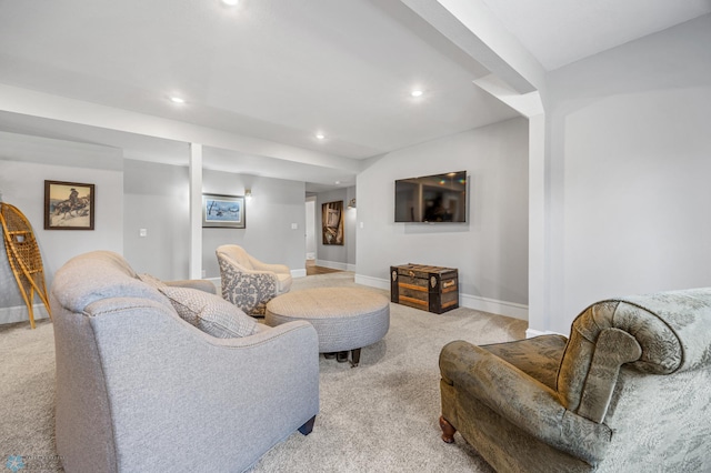 living room featuring light colored carpet, recessed lighting, and baseboards
