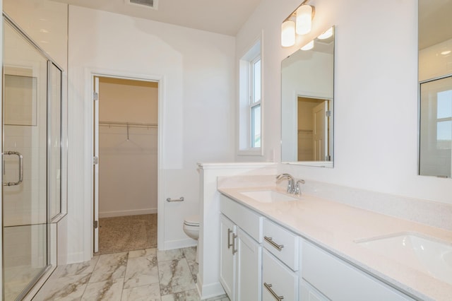 15149 Quince St NW, Andover, MN 55304 - bathroom with a walk in closet, a shower stall, a sink, and marble finish floor