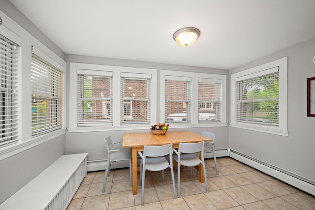 2511 12th Ave N, Minneapolis, MN 55411 - dining space featuring baseboard heating, light tile patterned flooring, plenty of natural light, and a baseboard radiator