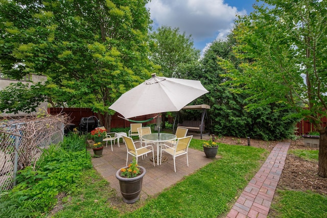 2511 12th Ave N, Minneapolis, MN 55411 - fenced backyard with a patio and outdoor dining space