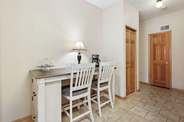 office area with baseboards and visible vents