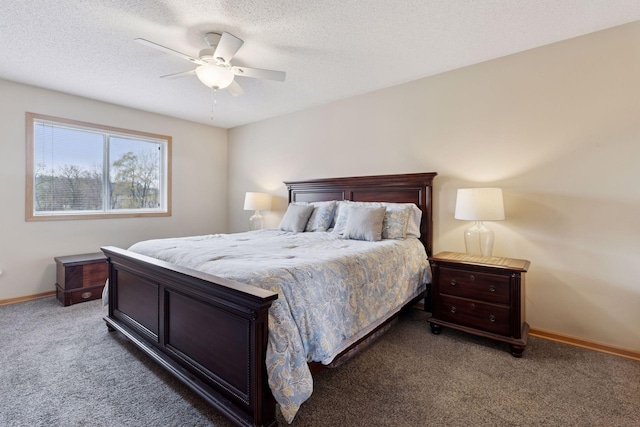 bedroom with a textured ceiling, carpet floors, baseboards, and a ceiling fan