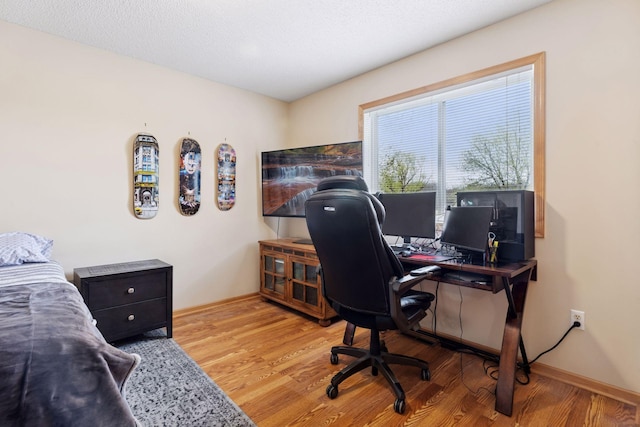 office space with wood finished floors