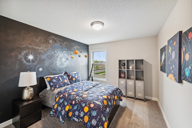 carpeted bedroom featuring a textured ceiling and baseboards