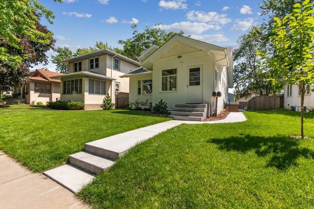 2170 Palace Ave, Saint Paul, MN 55105 - bungalow-style home featuring fence, stucco siding, and a front lawn