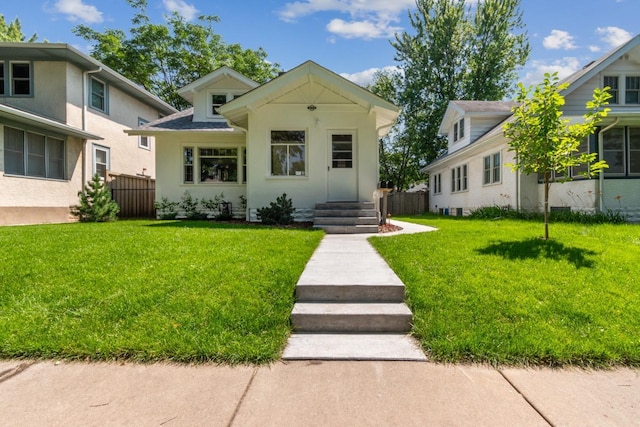 2170 Palace Ave, Saint Paul, MN 55105 - bungalow-style house with fence, a shingled roof, and a front lawn