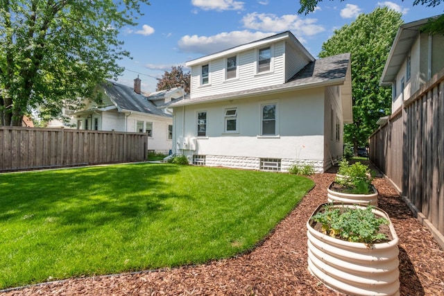 2170 Palace Ave, Saint Paul, MN 55105 - back of house featuring fence, a lawn, and roof with shingles