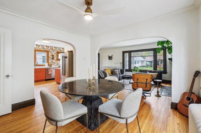 2170 Palace Ave, Saint Paul, MN 55105 - dining space with ceiling fan, arched walkways, plenty of natural light, and light wood-style flooring