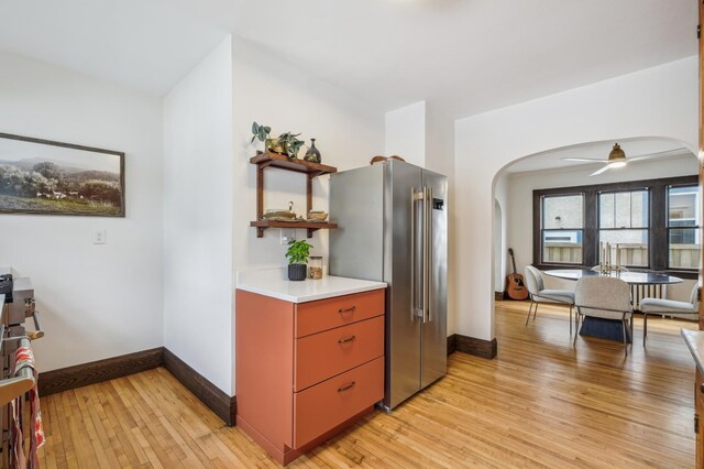 2170 Palace Ave, Saint Paul, MN 55105 - kitchen with high end refrigerator, arched walkways, open shelves, and light wood-type flooring