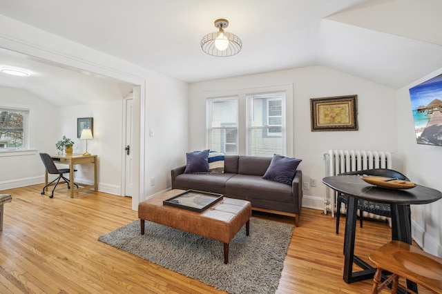 2170 Palace Ave, Saint Paul, MN 55105 - living area with radiator heating unit, baseboards, light wood finished floors, and lofted ceiling