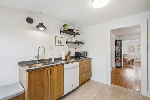 2170 Palace Ave, Saint Paul, MN 55105 - kitchen with brown cabinets, white dishwasher, open shelves, a sink, and stainless steel microwave