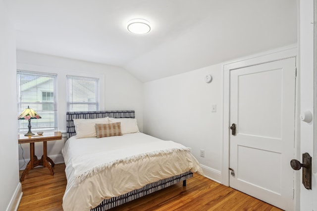 2170 Palace Ave, Saint Paul, MN 55105 - bedroom with baseboards, wood finished floors, and vaulted ceiling