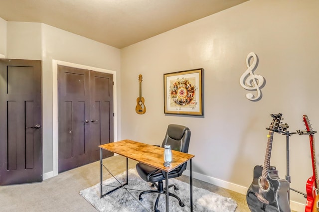 home office featuring baseboards and light colored carpet