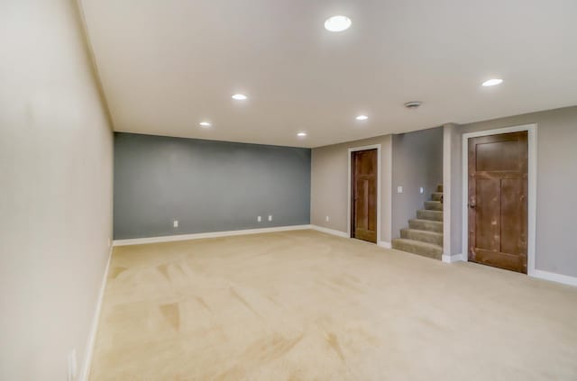 finished basement with carpet floors, recessed lighting, baseboards, and stairway