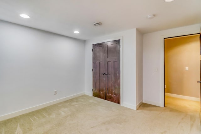 unfurnished bedroom featuring recessed lighting, carpet, and baseboards