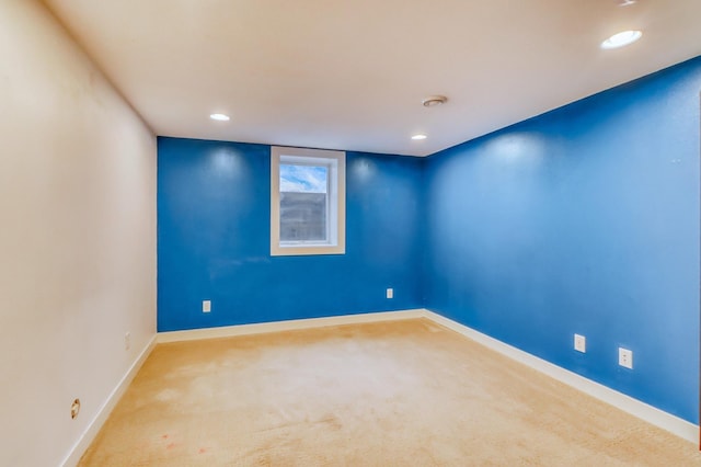 carpeted empty room with baseboards and recessed lighting