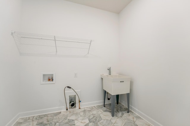 laundry room with gas dryer hookup, baseboards, laundry area, and hookup for a washing machine