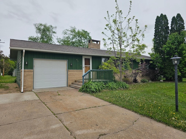 ranch-style house with brick siding, driveway, a chimney, an attached garage, and a front lawn