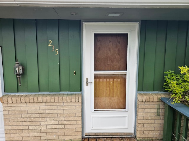 property entrance with board and batten siding