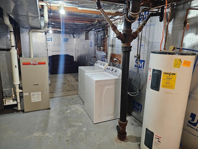 unfinished basement featuring water heater, washing machine and clothes dryer, and heating unit