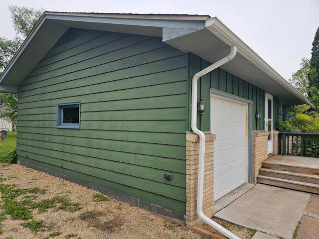 view of side of property featuring a garage