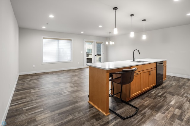 kitchen featuring baseboards, dark wood-style floors, and a sink
