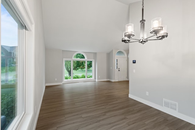 6360 Teton Ln, Chanhassen, MN 55317 - empty room featuring a chandelier and dark wood-style flooring