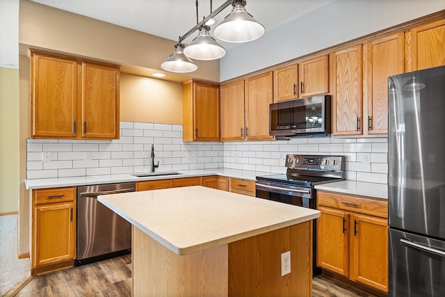 14012 54th Ave N Unit 4, Plymouth, MN 55446 - kitchen featuring appliances with stainless steel finishes, a sink, light countertops, dark wood-style floors, and tasteful backsplash