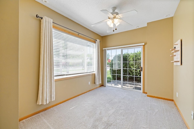 14012 54th Ave N Unit 4, Plymouth, MN 55446 - carpeted spare room with ceiling fan, baseboards, and a textured ceiling