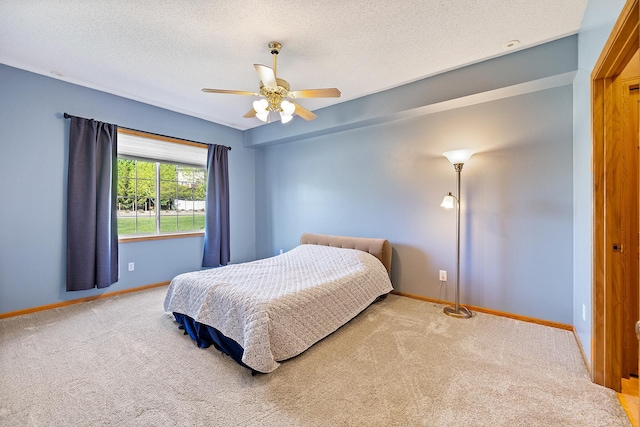 14012 54th Ave N Unit 4, Plymouth, MN 55446 - bedroom featuring carpet, baseboards, a textured ceiling, and ceiling fan