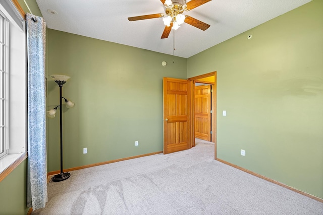 14012 54th Ave N Unit 4, Plymouth, MN 55446 - unfurnished bedroom featuring carpet flooring, baseboards, and a ceiling fan