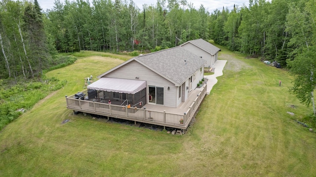 birds eye view of property featuring a wooded view