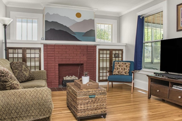 1449 Laurel Ave, Saint Paul, MN 55104 - living room with crown molding, light wood finished floors, and a brick fireplace