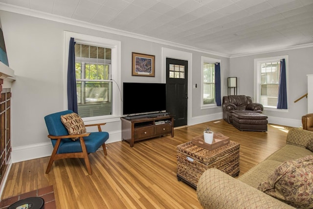 1449 Laurel Ave, Saint Paul, MN 55104 - living room with ornamental molding, wood finished floors, and baseboards