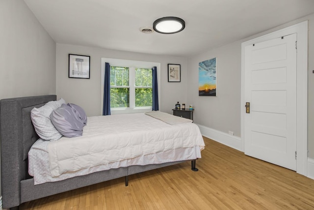 1449 Laurel Ave, Saint Paul, MN 55104 - bedroom featuring light wood-style flooring and baseboards