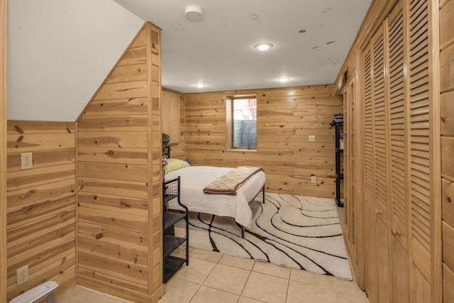 1449 Laurel Ave, Saint Paul, MN 55104 - bedroom with light tile patterned floors, wooden walls, recessed lighting, and a closet