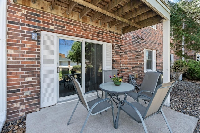 view of patio featuring outdoor dining area