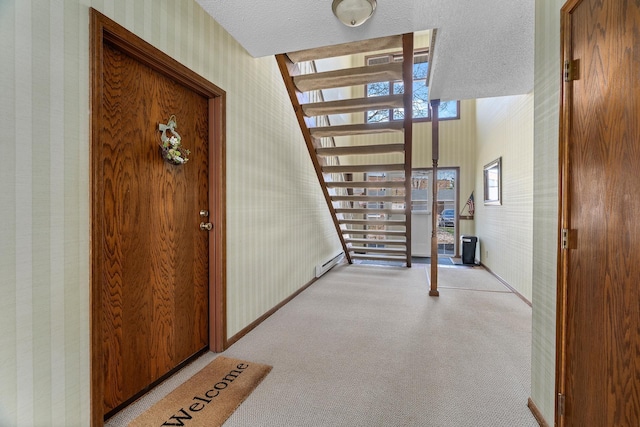 view of exterior entry featuring baseboard heating