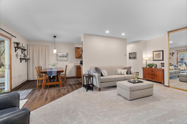 living room with baseboards, recessed lighting, and wood finished floors