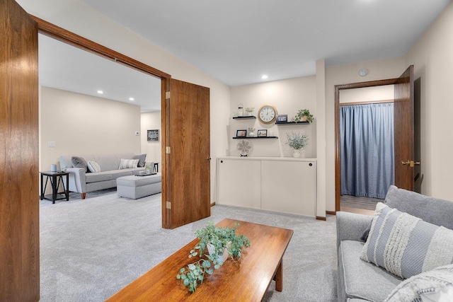 carpeted living room featuring recessed lighting