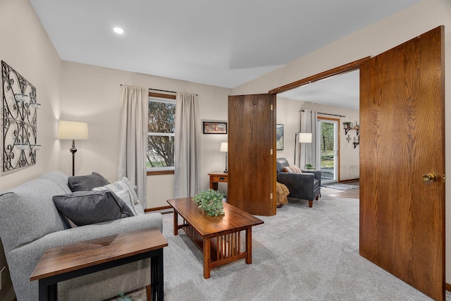 living room with plenty of natural light and light carpet